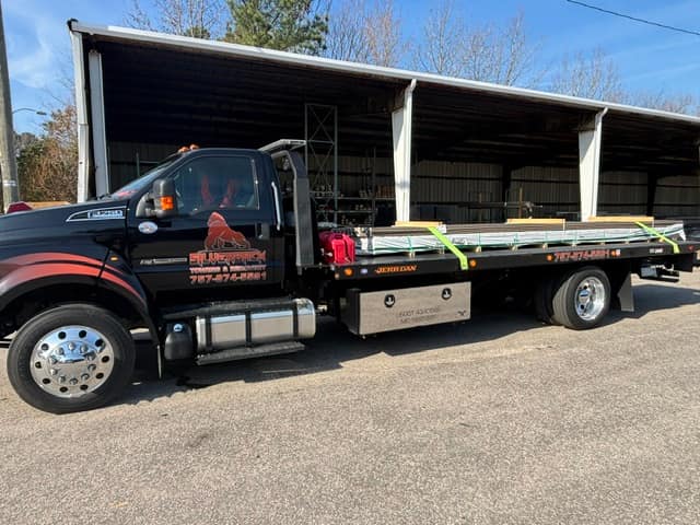 Empty Silverback rollback deck with tie-down straps ready for the next job