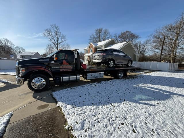 Car towed through snow on the Silverback rollback