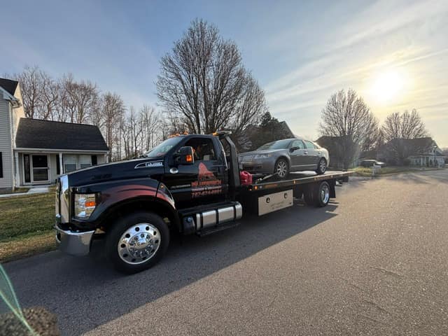 Sedan towed from a residential street on the Silverback flatbed