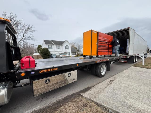 Large tool chest delivered on the Silverback rollback beside a box truck